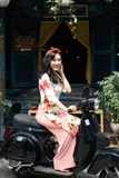 Áo dài cách tân hoa lá màu xanh lơ