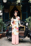 Áo dài cách tân hoa lá màu xanh lơ
