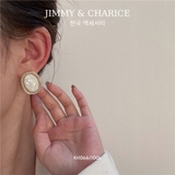 khuyên bầu dục đá trắng viền vàng