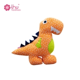 gối thú bông khủng long nền vàng cam