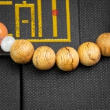 Vòng trầm hương tròn banh đỏ 8 li mix ngọc hồng