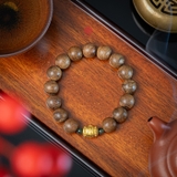 Vòng tay Trầm Hương tròn 12 li cận chìm mix Lu Thống vàng 24k