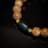 Vòng tay Trầm Hương tròn 10 li cận chìm mix Ngọc Lu Thống