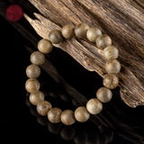 Vòng tay Trầm Hương tròn 10 li banh bông