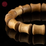 Vòng tay Trầm Hương trúc xương 10 li banh đỏ