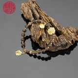 Vòng tay Trầm Hương cho nữ tròn cận chìm 6 li mix charm vàng