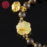 Vòng tay Trầm Hương cho nữ tròn cận chìm 6 li mix charm vàng