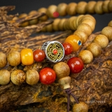 Chuỗi trầm hương 108 hạt 7 li banh mix đá Tây Tạng