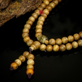 Chuỗi trầm hương 108 hạt 8 li banh mix charm bạc