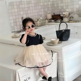 Đầm xoè đen nơ lưng