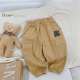 Quần kaki đính cúc phối túi hộp