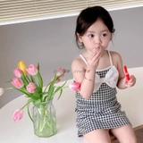 Set váy 2 dây kẻ đính nơ ngực