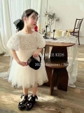Đầm ren trắng hoa nổi phối nơ lưng