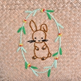 Seagrass basket with rabbit embroidery