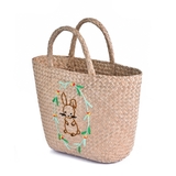 Seagrass basket with rabbit embroidery