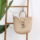 Seagrass basket with rabbit embroidery