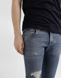 Dolce & Gabbana distressed logo-plaque jeans