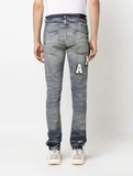 AMIRI Varsity ripped skinny jeans