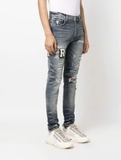 AMIRI Varsity ripped skinny jeans
