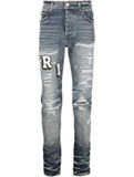 AMIRI Varsity ripped skinny jeans