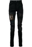 AMIRI appliqué-logo distressed-effect slim-fit jeans