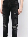 AMIRI distressed skinny jeans