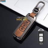 Bộ ốp kim loại mặt da + lưng da bò dập chìm logo mix móc khoá Mazda