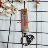 Móc khoá dây da T2 dài chất liệu da bò dập chìm logo