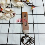 Móc khoá dây da T2 dài chất liệu da bò dập chìm logo