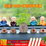 Bộ 4 tượng chú tiểu có đế lò xo