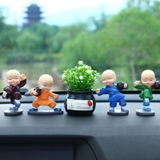 Bộ 4 tượng chú tiểu có đế lò xo