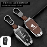 Bộ ốp kim loại lưng da + móc khoá dây da hãng Peugoet