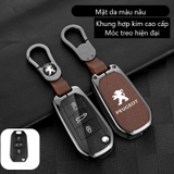 Bộ ốp kim loại lưng da + móc khoá dây da hãng Peugoet