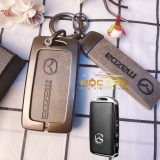 Bộ ốp kim loại mặt da + lưng da bò dập chìm logo mix móc khoá Mazda