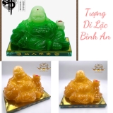 Tượng di lặc ngồi cầm thỏi tiền vàng
