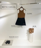 Chân váy PRADA đen viền da nâu