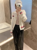 Aó khoác len Chanel viền hồng đen