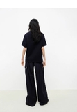 Tshirt MO&CO FREE KEIN đen họa tiết