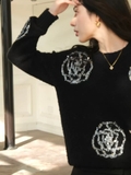 Áo len đen Chanel hoa