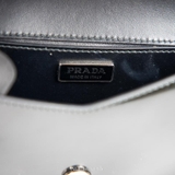 Prada Spazzolato Triangle Logo Plate Flap Chain Bag – Đen sang trọng & hiện đại