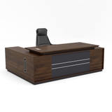 Bàn Lãnh Đạo Chữ L BGDY049L với mặt bàn gỗ óc chó đậm, hộc tủ bên trái tiện dụng, thiết kế mạnh mẽ phù hợp văn phòng lãnh đạo hiện đại.