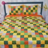 Yellow flower blanket on green grass