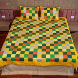 Yellow flower blanket on green grass