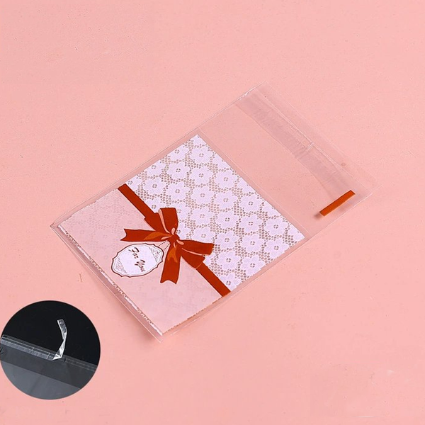 Túi dán mép nơ đỏ (100c) 7*7cm