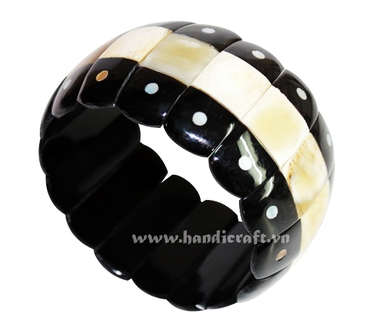 Horn bangle bracelet with bone inlay