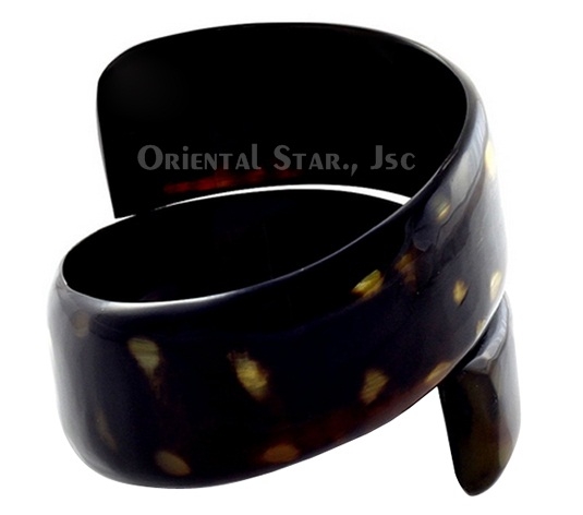 Black rolling horn bangle bracelet with polka dots