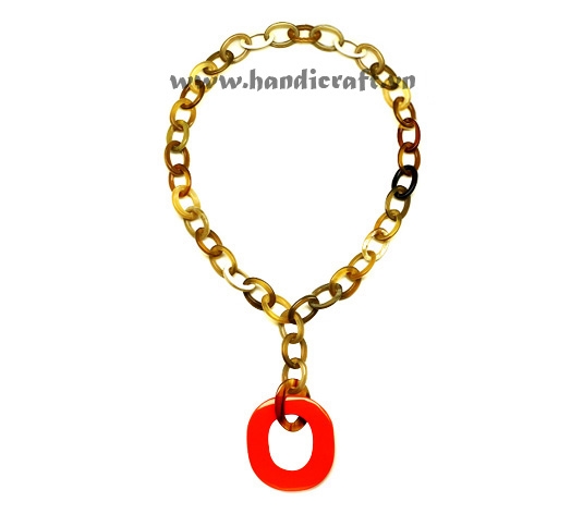 Small oval horn with large lacquer pendant necklace