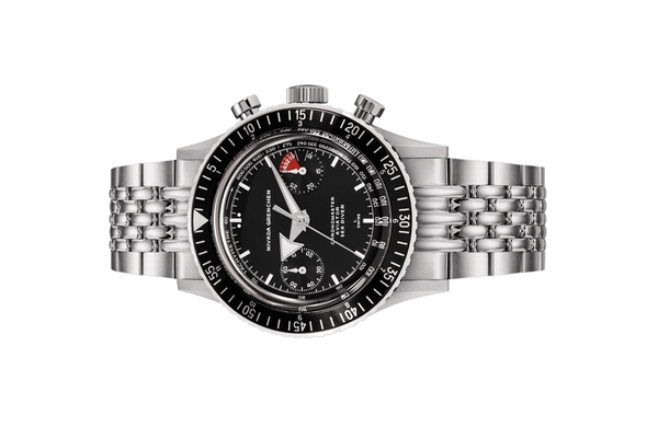 Đồng hồ đeo tay thương hiệu Nivada Grenchen, dòng sản phẩm Chronomaster White Broad Arrow, Ref no: 86007WM, mặt số màu đen, size 38mm, lên dây cót bằng tay, vỏ và dây đồng hồ bằng thép không gỉ, mới 100%