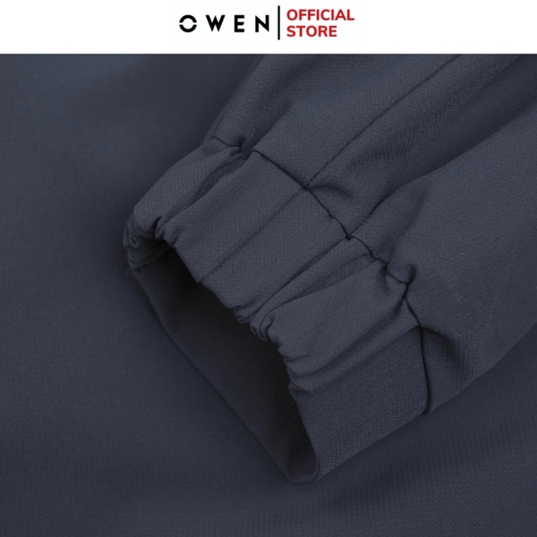 Bộ mặc nhà OWEN BMN241335 màu xanh đậm dáng reguler, áo cổ 3 phân, khóa kéo, tay và gấu bo chun, quần cạp chun ống suông chất liệu CVC spandex