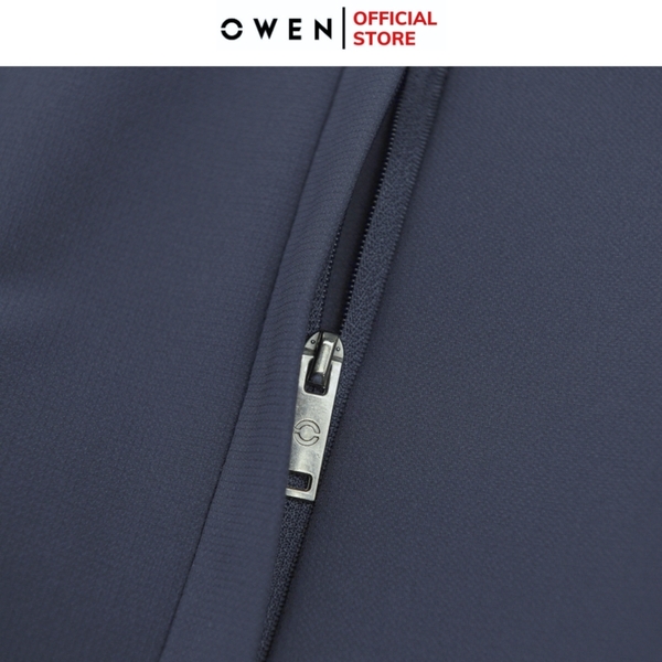 Bộ mặc nhà OWEN BMN241338 màu xanh than đậm dáng reguler, áo cổ 3 phân, khóa kéo, tay và gấu bo chun, quần cạp chun ống suông chất liệu CVC spandex